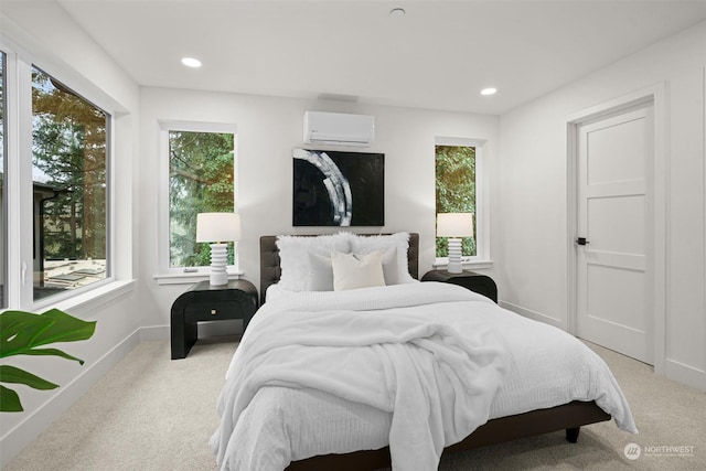 carpeted bedroom with a wall mounted air conditioner