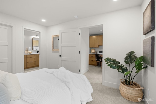 carpeted bedroom with ensuite bathroom