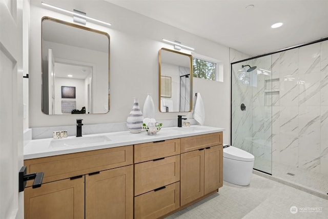 bathroom with toilet, a shower with shower door, and vanity