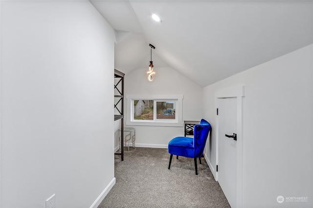 sitting room featuring lofted ceiling and carpet floors