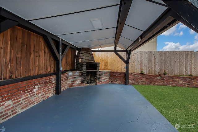 view of patio featuring a fireplace