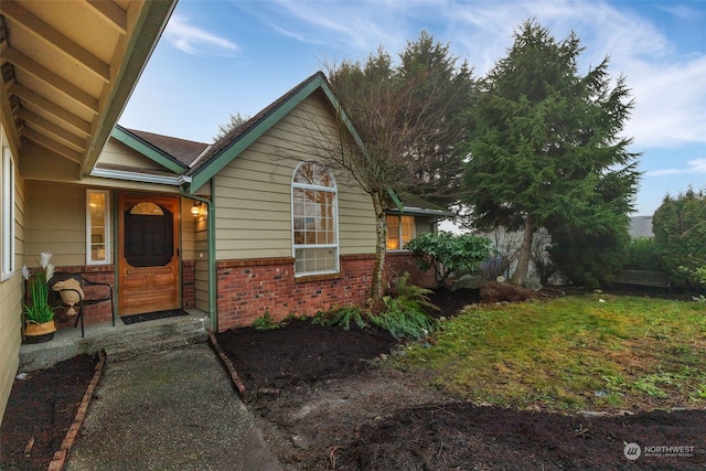 view of home's exterior with a lawn