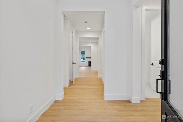 corridor featuring light wood-type flooring