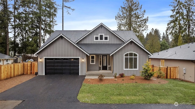 view of front of property with a garage and a front yard