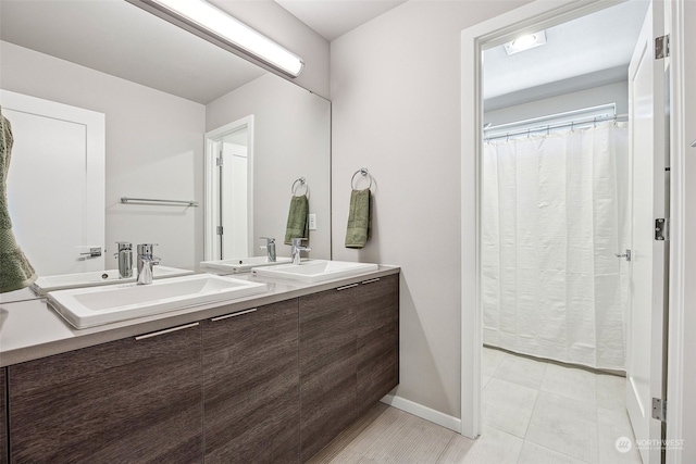 bathroom featuring vanity and tile patterned floors