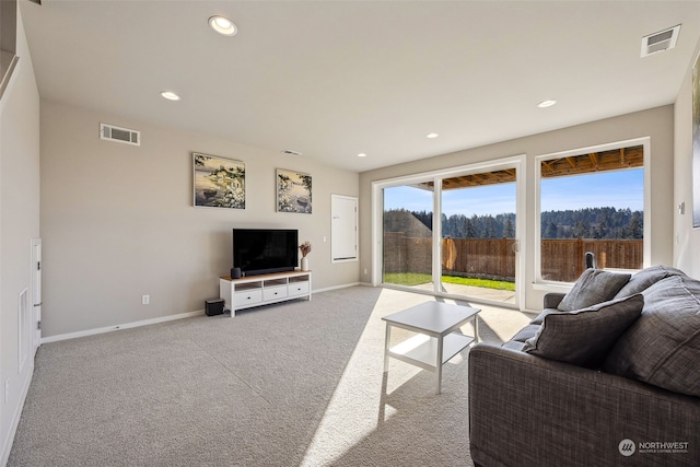 living room featuring light carpet