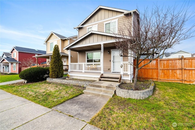 view of front of home featuring a front lawn and a porch