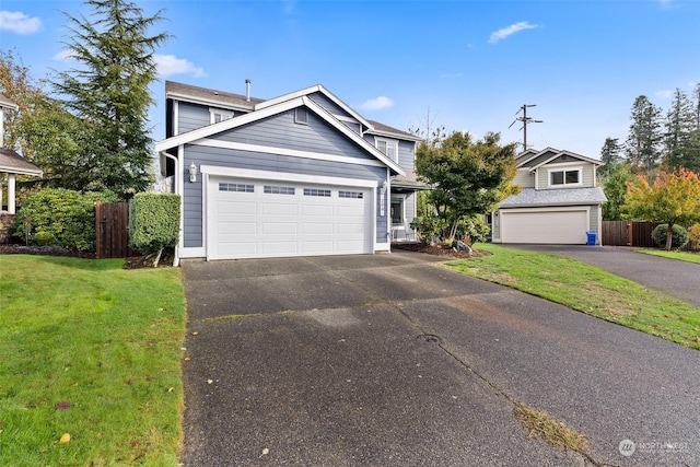 view of front of property featuring a garage and a front yard