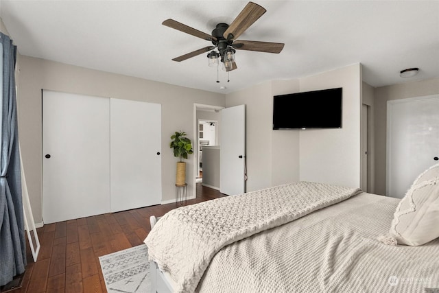 bedroom featuring ceiling fan and dark wood-type flooring