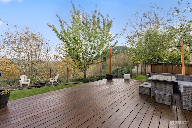 wooden terrace featuring an outdoor hangout area