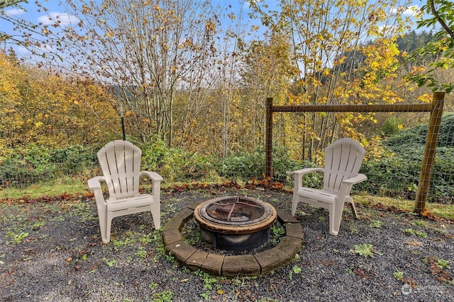 view of yard with an outdoor fire pit