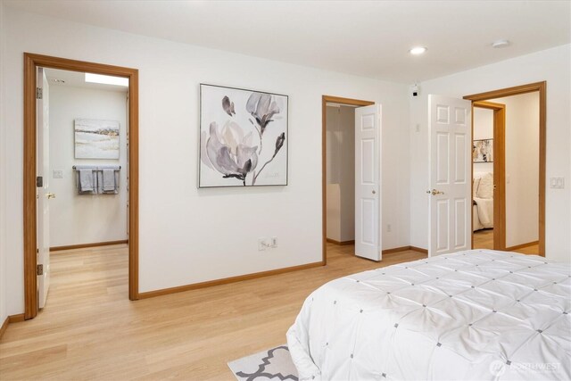 bedroom featuring light wood finished floors, recessed lighting, and baseboards