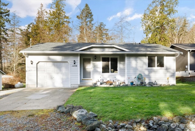 ranch-style home with a garage and a front yard