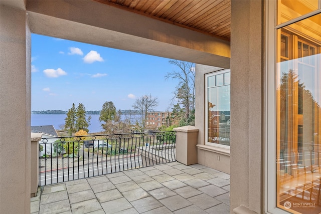 balcony featuring a water view