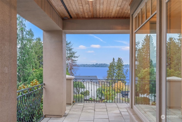 balcony featuring a water view