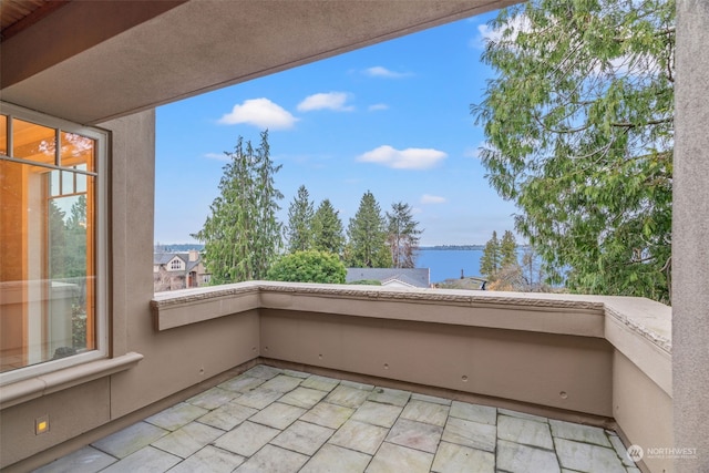 balcony featuring a water view