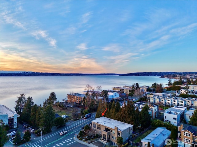 aerial view at dusk with a water view