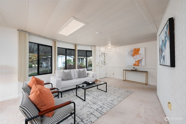 living room with brick wall and a textured ceiling