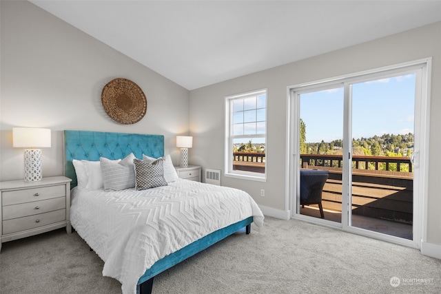 carpeted bedroom with lofted ceiling and access to outside