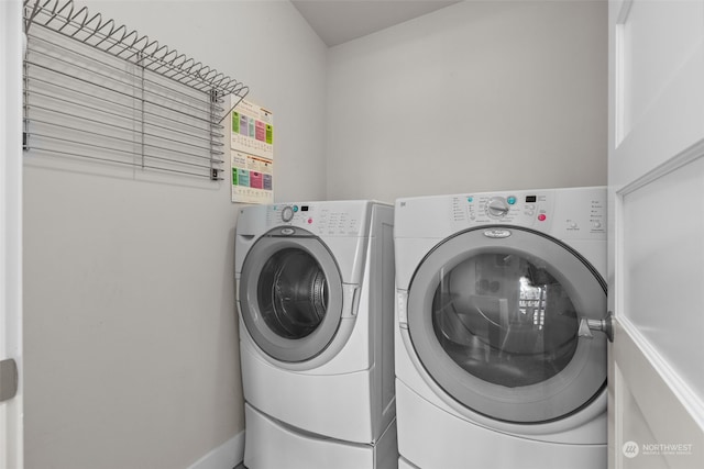 washroom featuring washer and clothes dryer