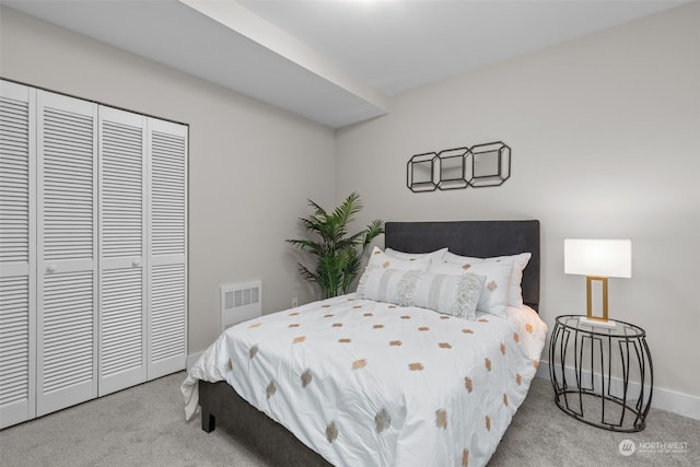 carpeted bedroom with a closet