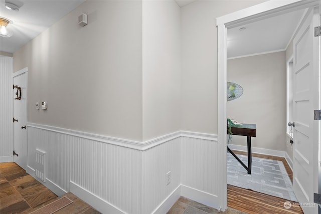 hallway with hardwood / wood-style flooring