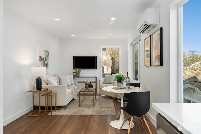 living room with an AC wall unit and dark hardwood / wood-style floors