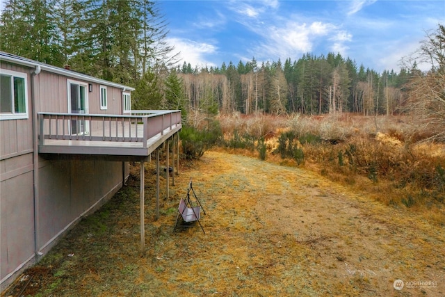 view of yard with a wooden deck