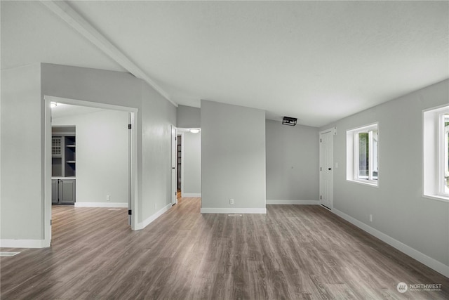 unfurnished room featuring hardwood / wood-style floors