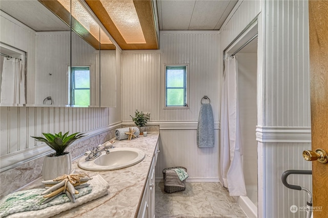 bathroom with vanity and curtained shower