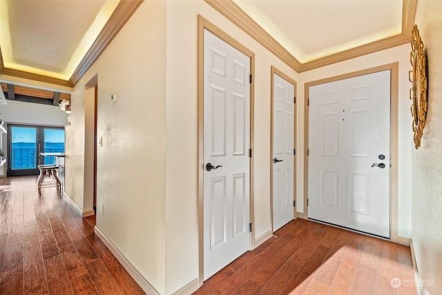 interior space with ornamental molding and hardwood / wood-style floors