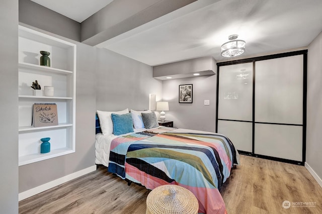 bedroom with light hardwood / wood-style flooring