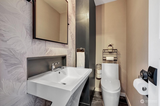 bathroom featuring sink and toilet