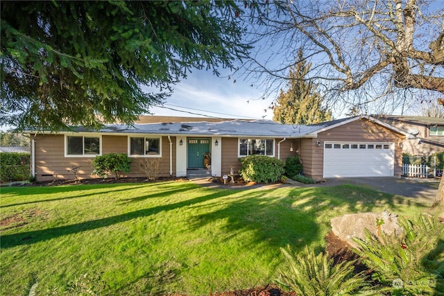 single story home featuring a garage and a front lawn