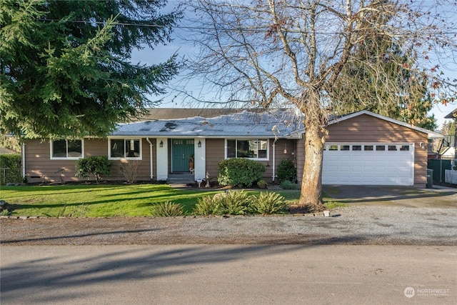 single story home featuring a garage and a front yard