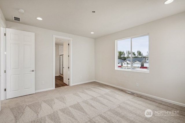 unfurnished bedroom featuring light colored carpet