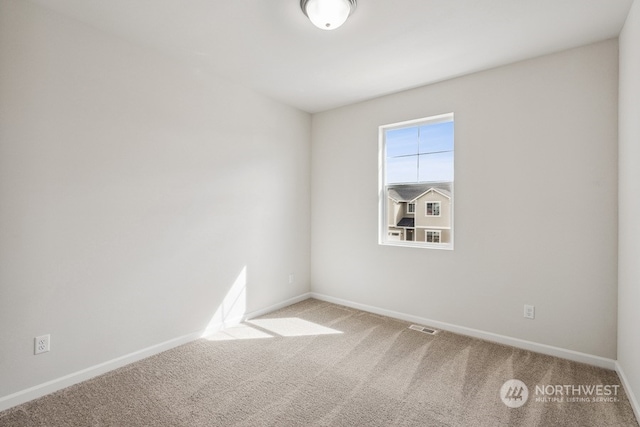 view of carpeted spare room