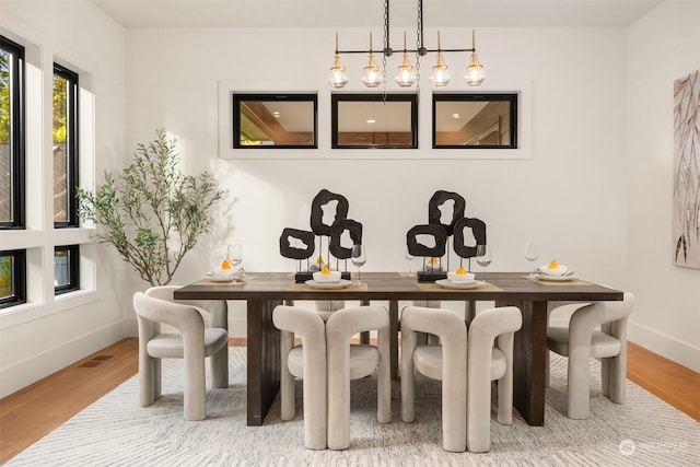 dining area featuring wood-type flooring