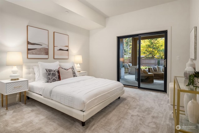 bedroom with light colored carpet and access to outside