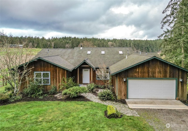 single story home with a garage and a front yard