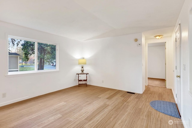 empty room with light hardwood / wood-style floors