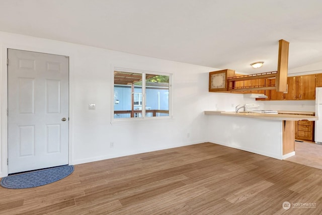 interior space with light wood-type flooring and sink