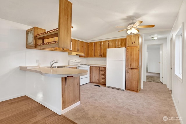 kitchen featuring ceiling fan, white appliances, sink, kitchen peninsula, and vaulted ceiling