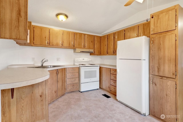 kitchen featuring kitchen peninsula, vaulted ceiling, ceiling fan, sink, and white appliances