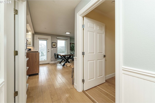 hall with light wood-type flooring