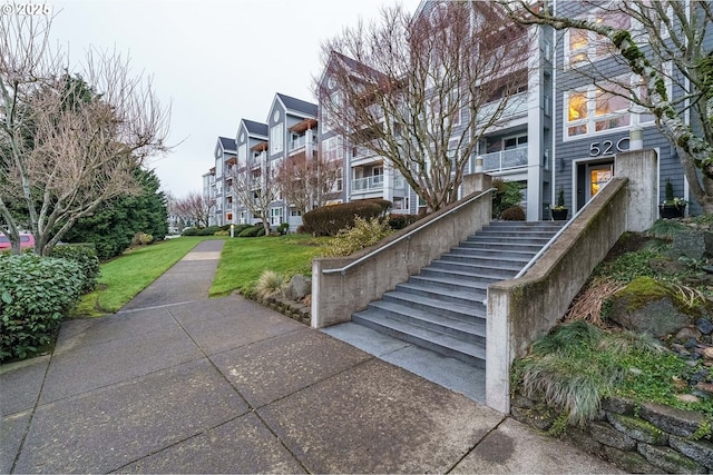 view of property's community featuring a lawn