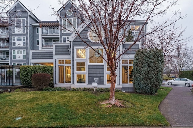 rear view of house with a lawn