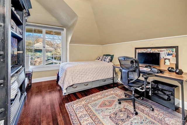 bedroom with vaulted ceiling and dark wood-type flooring