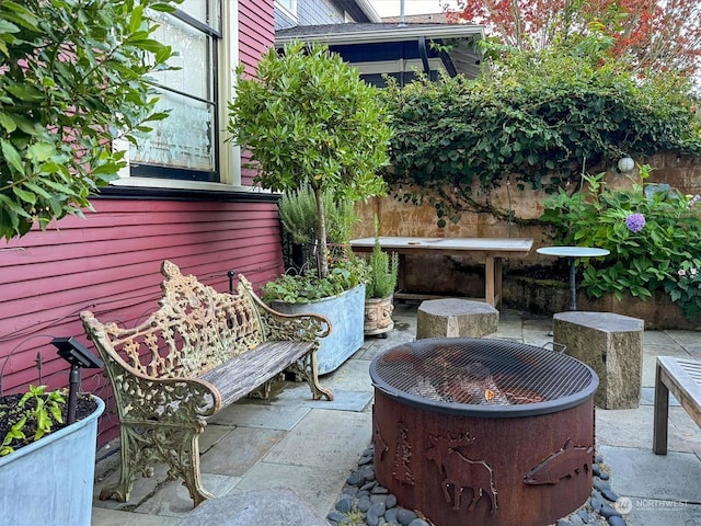 view of patio / terrace featuring a fire pit