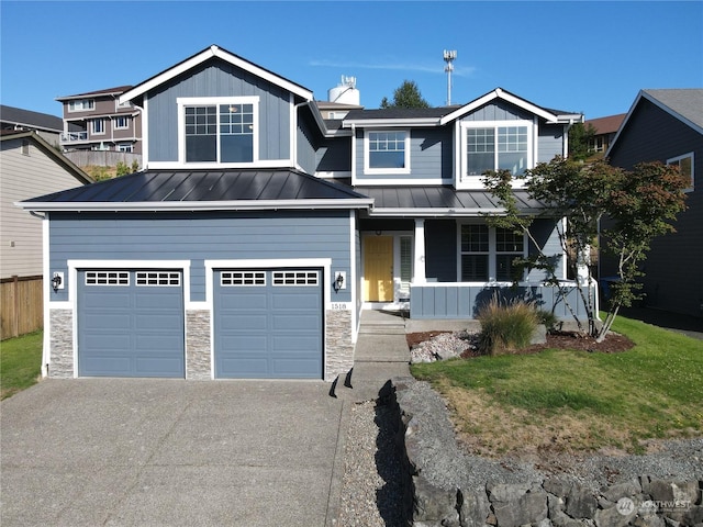 view of front of property featuring a porch, a garage, and a front yard